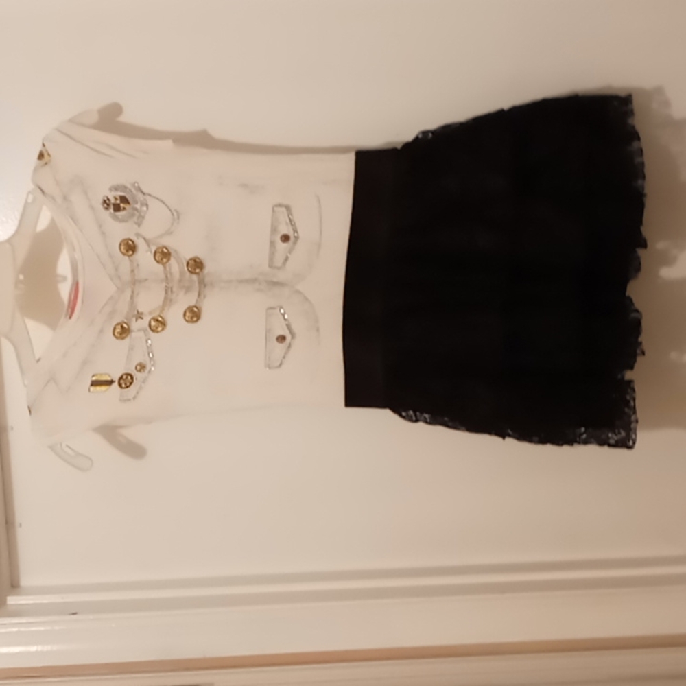 Girls dress with black lace at the bottom